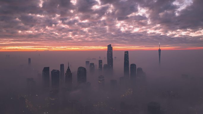 航拍早晨云雾日出天际线与珠江新城、广州塔