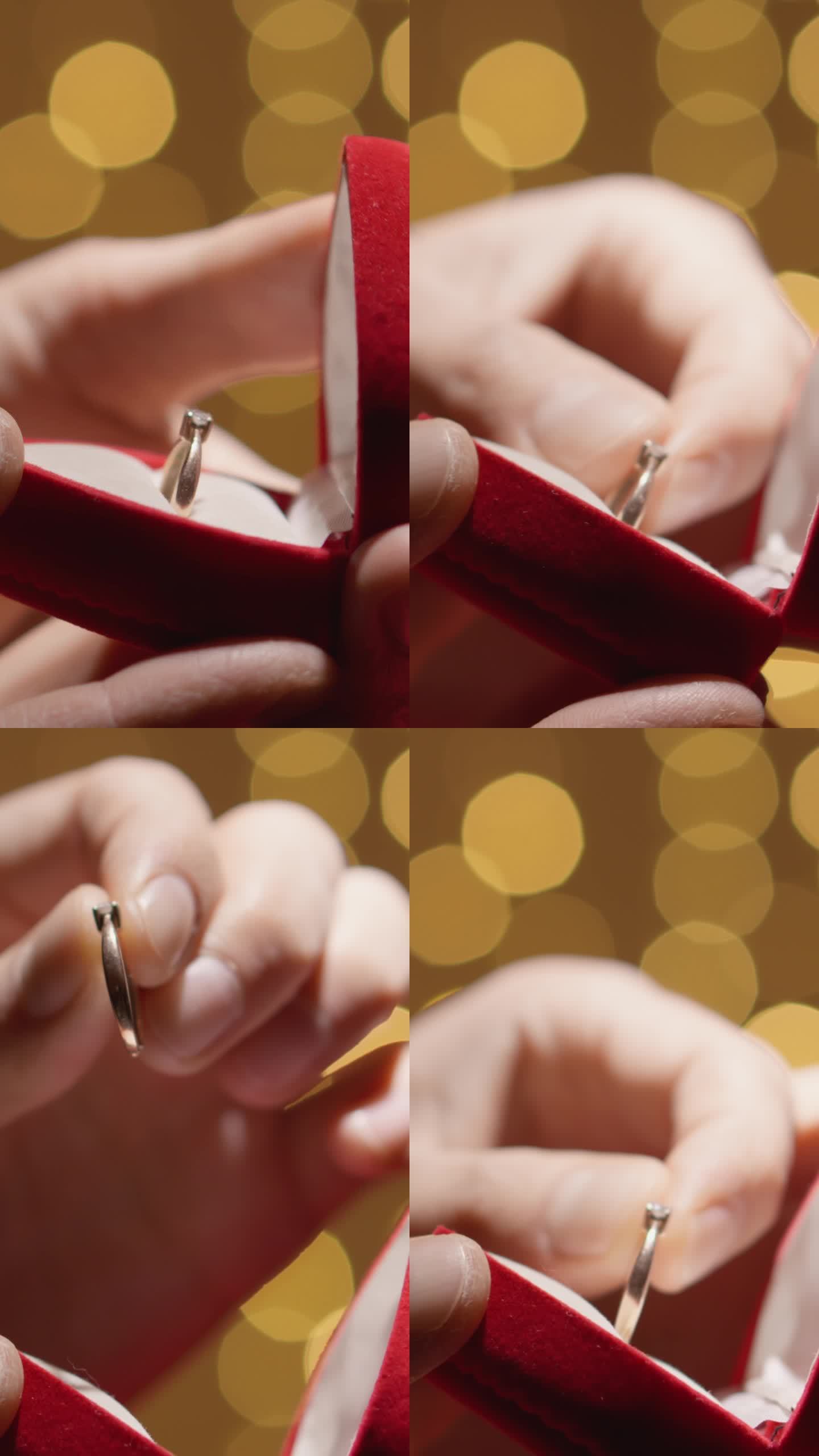 垂直视频。一个男人准备向他的女朋友求婚。他拿着一个漂亮的盒子，拿出一枚非金钻戒。为情人节和情人节准备