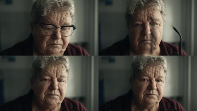 孤独的老妇人在家里摘下眼镜，带着悲伤的眼神看着相机的特写肖像