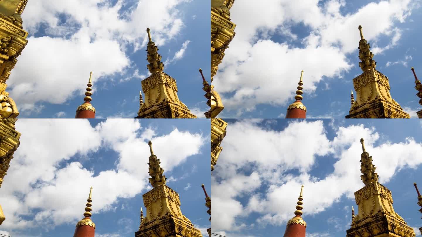 寺庙场地上的装饰性埋葬佛塔。蓝色天空中季风云的动态变焦时移与运动控制。