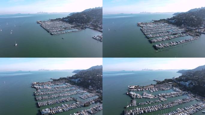 无人机捕捉到繁华的索萨利托码头，以标志性的旧金山城市景观和海湾大桥为背景。