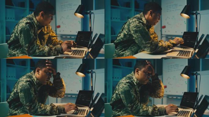 非裔美国情报官员在办公室打笔记本电脑，策划策略