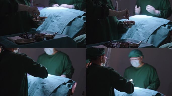 手术室里，一名护士用镊子夹住棉球，用聚维酮碘浸泡在病人的手术伤口上擦拭消毒。