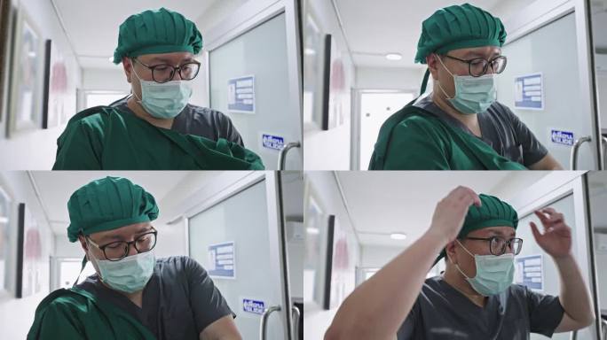 图为做完手术的医生脱下手术帽，助手帮他脱下绿色手术服，走在办公室前的走廊上。