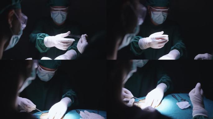 在昏暗的手术室里，一名医生从护士那里拿起手术工具并回到护士身边，而一名助手正试图在病人腹部进行手术时