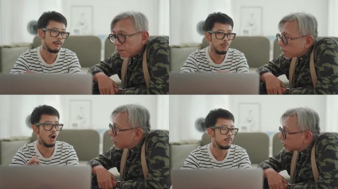 几代人的联系:亚洲男人在家工作，与他的长辈分享微笑和交谈。
