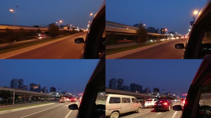 暮色降临的北京车窗外景公路