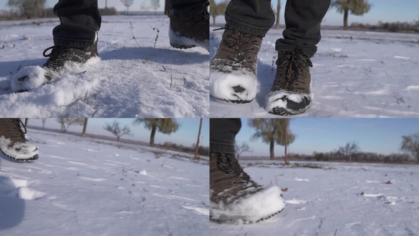 在深雪中行走的脚是慢镜头。徒步旅行者的脚步。冬季户外休闲活动