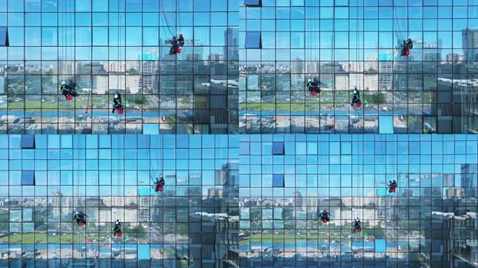 蜘蛛人在城市清洗大楼玻璃 高空作业