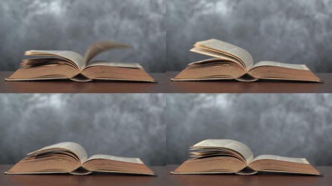 打开书的侧视图模型。现实翻页。木桌上打开了一本古书