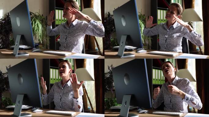 情感快乐的年轻女子看着电脑屏幕