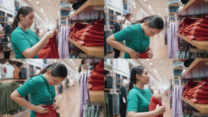 一名亚洲女顾客在街市上挑选衣服