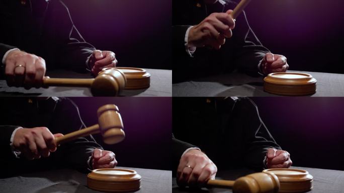 男法官手敲铁锤，宣判无罪或有罪。开庭审理案件的裁定令、法律判决和犯罪判决