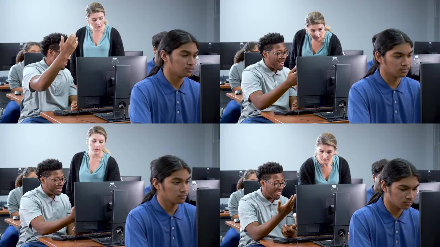 计算机实验室里的高中生和老师