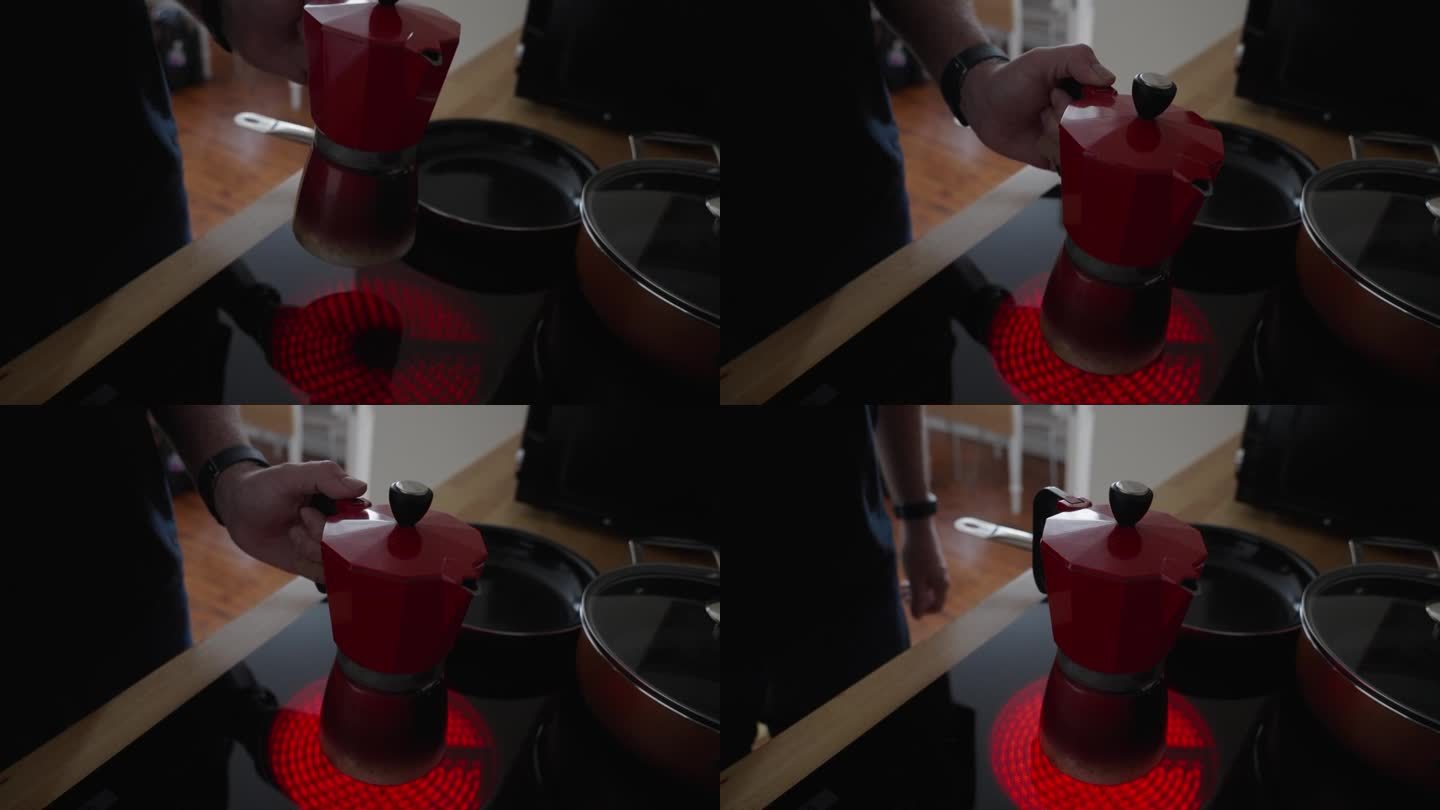一个人打开陶瓷电炉的燃烧器，把一个红色的浓缩咖啡壶放在灼热的发光元件上