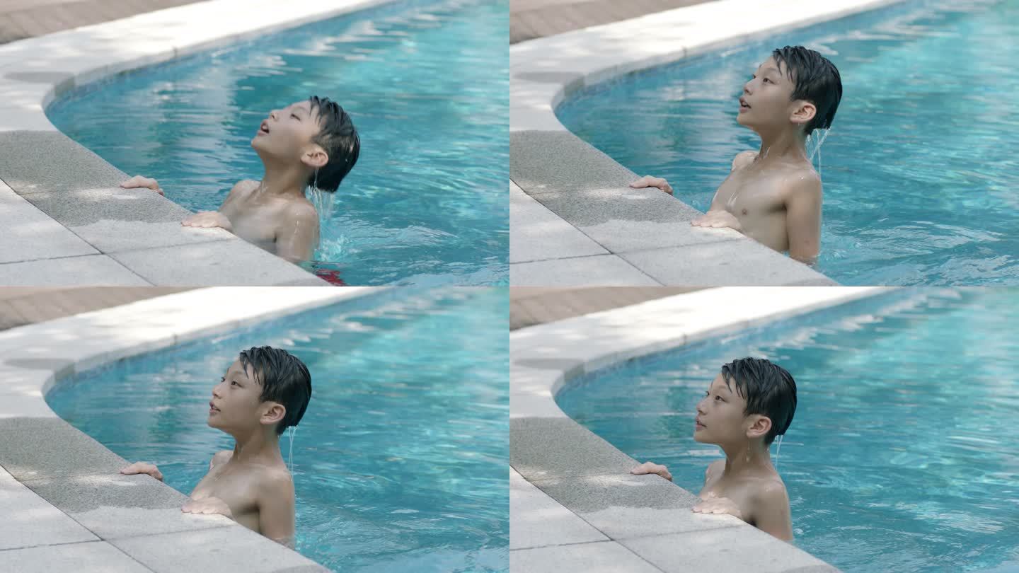 慢动作 游泳的男孩从泳池探出脑袋
