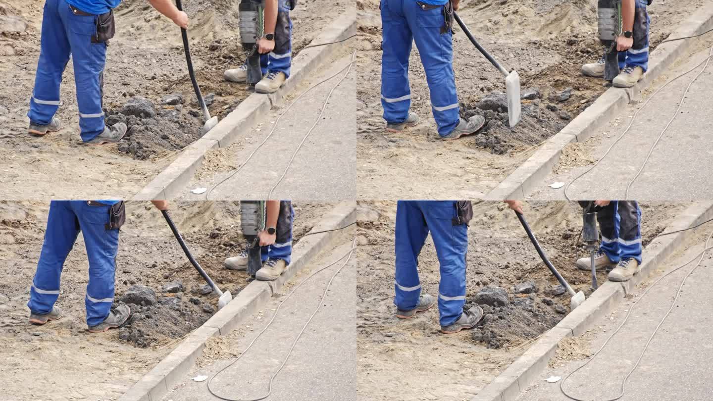 道路工程地盘承建商用铁铲及风锤更换混凝土路沿砖