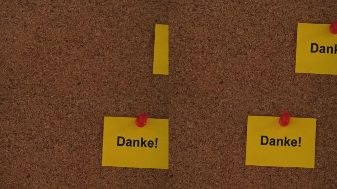 一张写着“丹克”的黄色纸条!(用德语说谢谢)把它钉在一块软木板上。