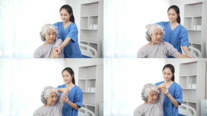 理疗师为一名亚洲老年妇女进行物理治疗，检查一名女病人受伤手臂的治疗情况，以女医生的保健理念使疼痛的手