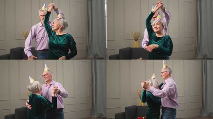 浪漫的老年夫妇戴着派对帽庆祝生日纪念日，一起在家里随着音乐跳舞。幸福的家庭，退休的男人，女人，丈夫，