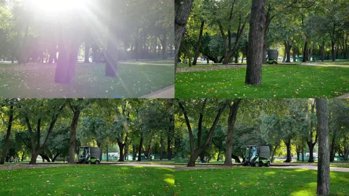 城市改善的概念
阳光明媚的早晨在城市公园
公共服务部门使用带清洁刷的小型扫地机清洁鹅卵石
阳光透过树