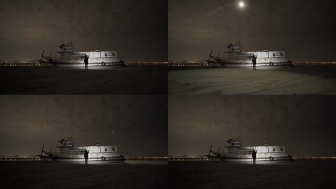女生在天兴洲废弃的旧船旁玩无人机光绘摄影