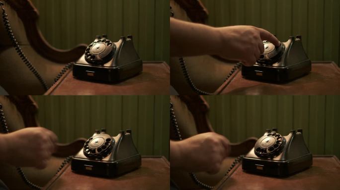 用90年代的旧电话打电话。一个男人的手拿起电话，拨了一个号码。