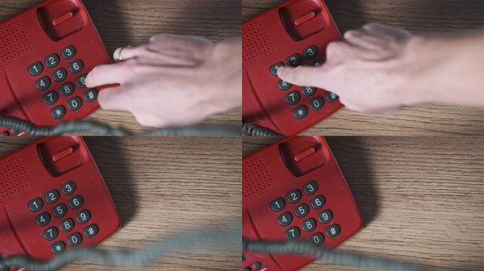 用带有拨号键的老式红色电话拨打911
