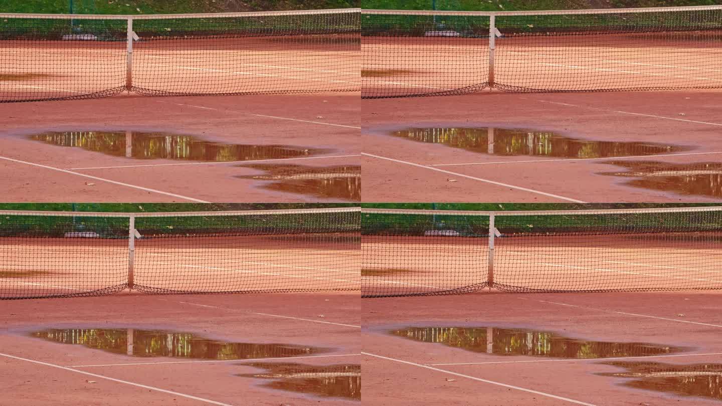 红土网球场的湿面，有大的雨水水坑