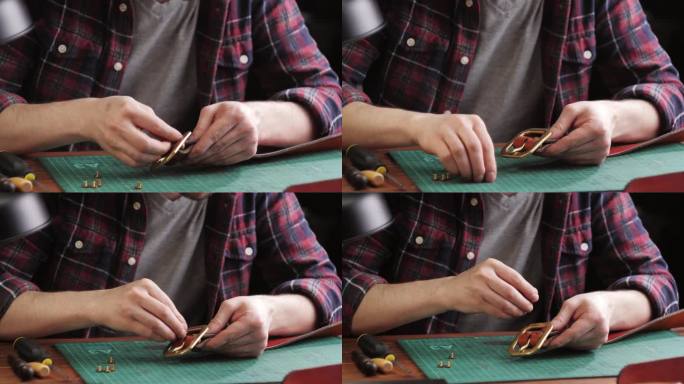 男裁缝用尺子裁剪人造革特写。工匠在工作桌上雕刻牛皮，制作用真皮制作的手工制品。专业的工作室。