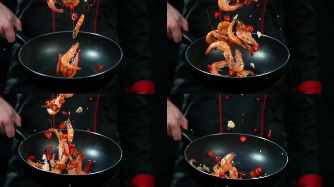 厨师拿着炸飞虾的超级慢镜头。