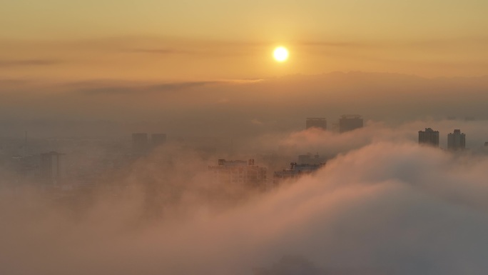 瑞丽市城市高楼云海日出梦幻风景