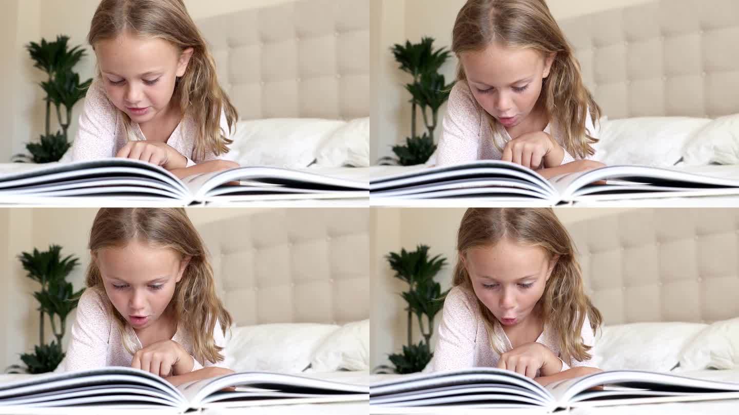 情绪激动的孩子读了有趣的百科全书。小孩子喜欢张开嘴阅读书中的新事实。培养孩子的幻想。想象的世界童话。