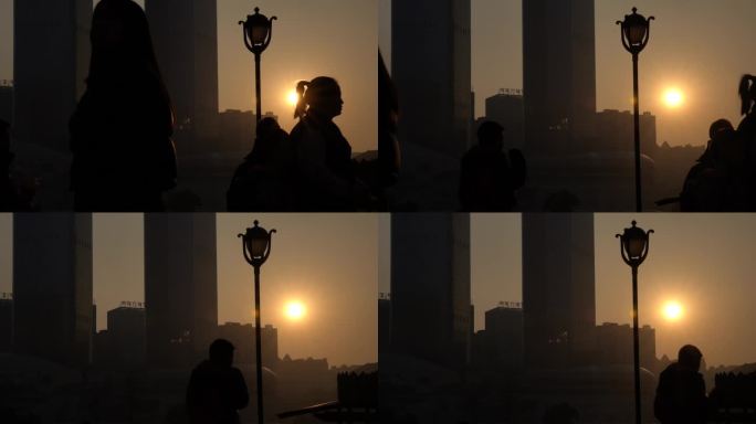 人流剪影光影日落