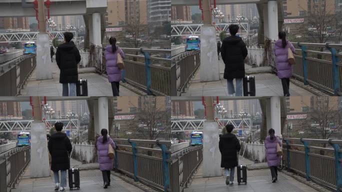 拉着行李箱的两个人