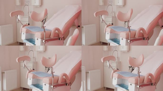 医院柜子里粉色调的妇科椅
