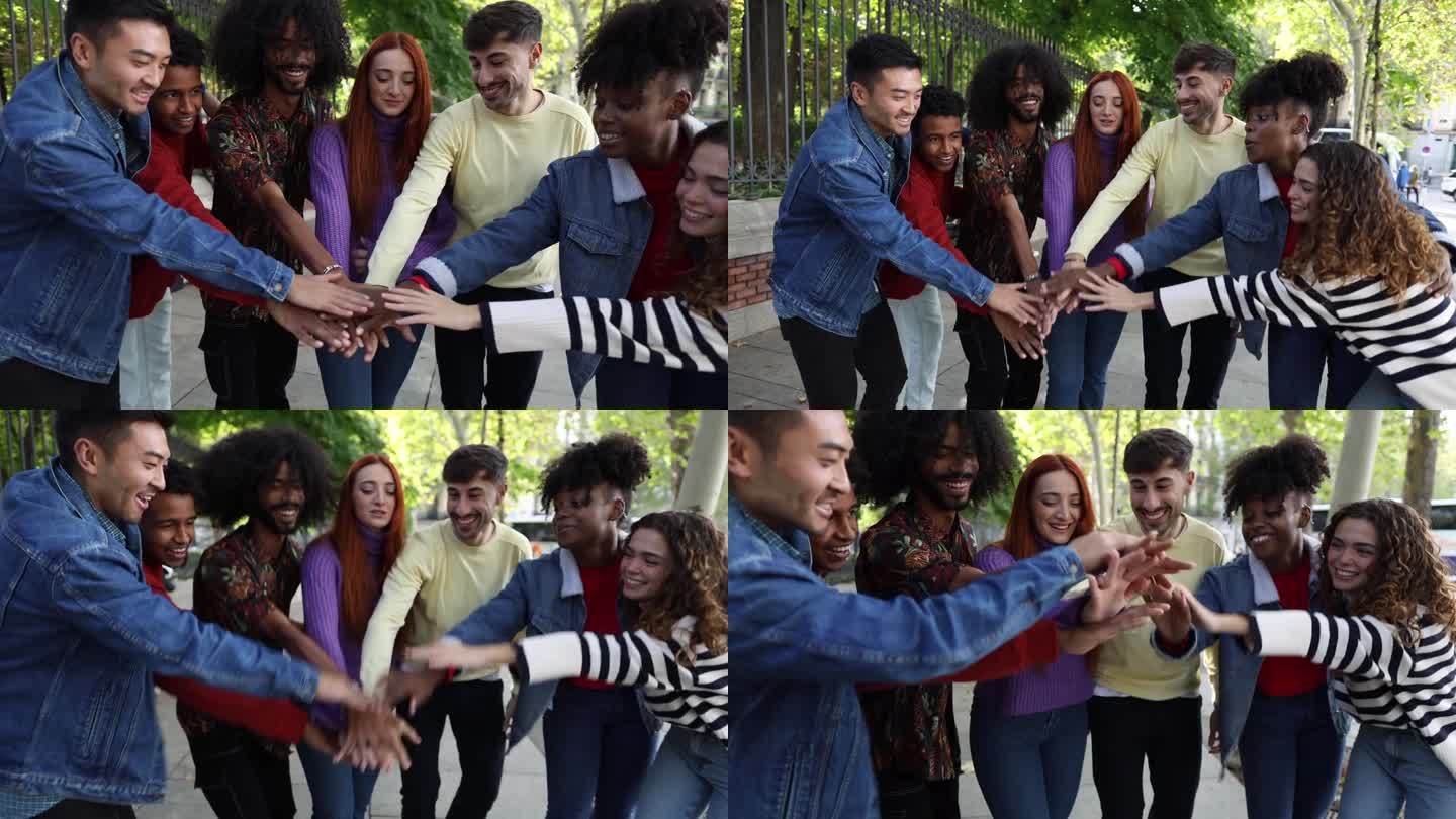 一群多元文化的朋友手拉手，边笑边欢呼的视频——友谊与多元理念