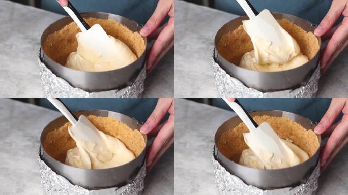 女性双手制作起司蛋糕，她把起司蛋糕放进模具视频慢动作镜头