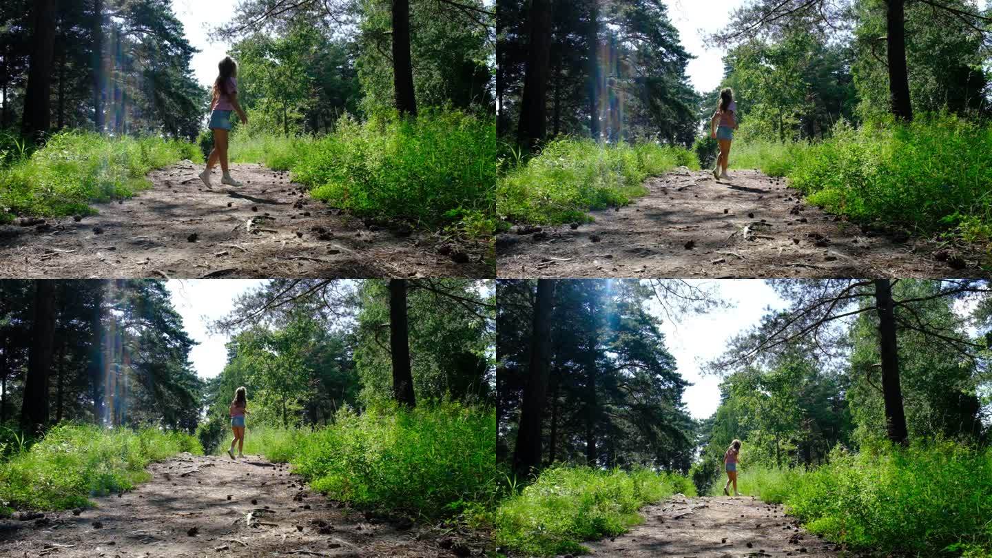 孩子女孩在草地上，森林里，散步，跑步，跳舞，在阳光明媚的夏日享受快乐时光，呼吸。雨后的森林，空气清新