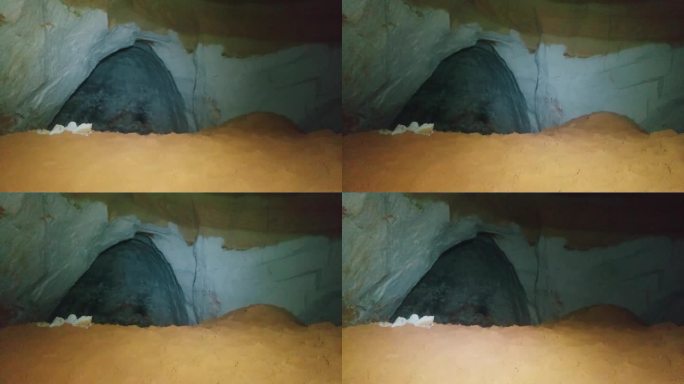 地下洞穴，里面微弱的灯光。