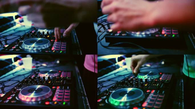一些DJ迷你混音器与男性的手DJ播放音乐的轨道在夜总会