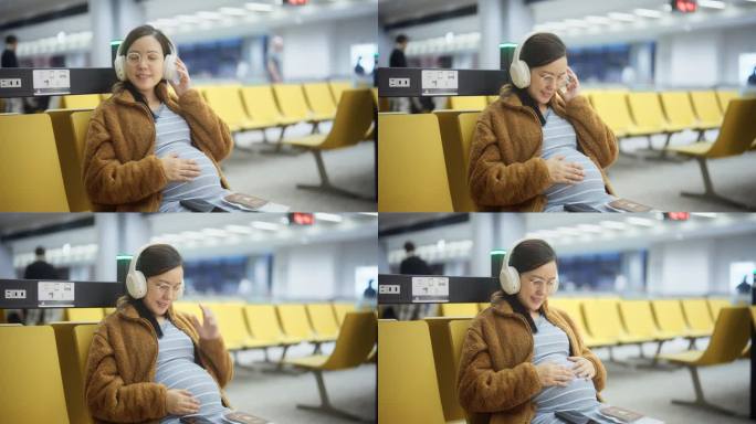 在机场听音乐的孕妇轻轻地摸着肚子