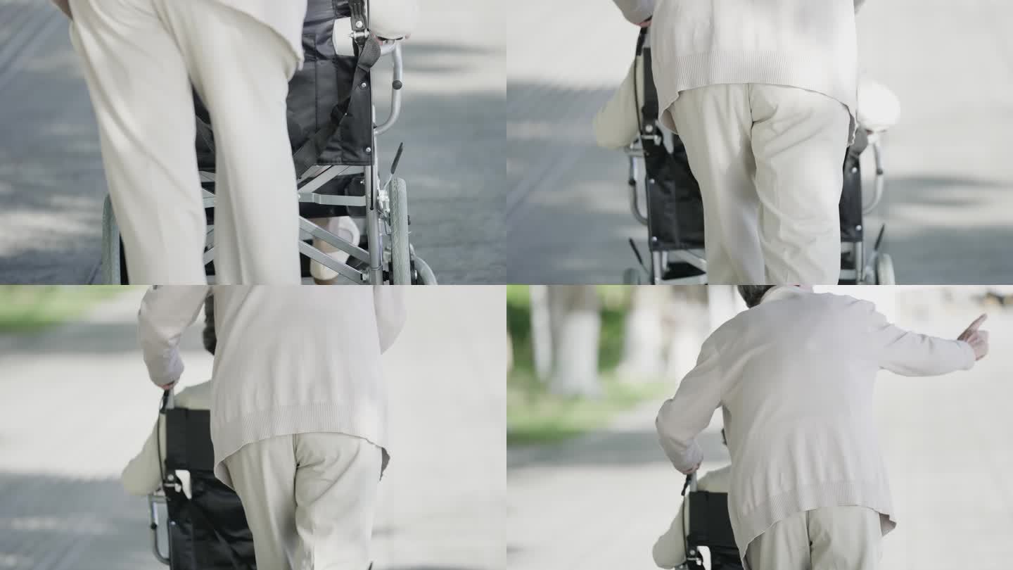 推轮椅照顾老伴老人背影