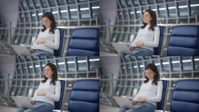 一位亚洲女商人在机场门口等候时正在用笔记本电脑工作