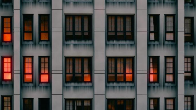 公寓大楼的正面。无人机拍摄的塔楼立面。三维动画的建筑物在晚上。滚动一个塔的正面。建筑物被照亮的窗户