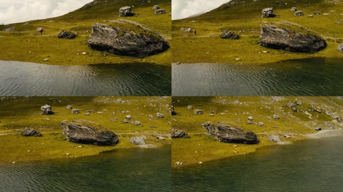 令人惊叹的无人机飞行视图在高山湖在阿尔卑斯山