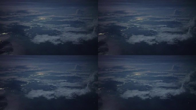 午夜多云的天空和月亮照耀在达南湾海从飞机上看越南