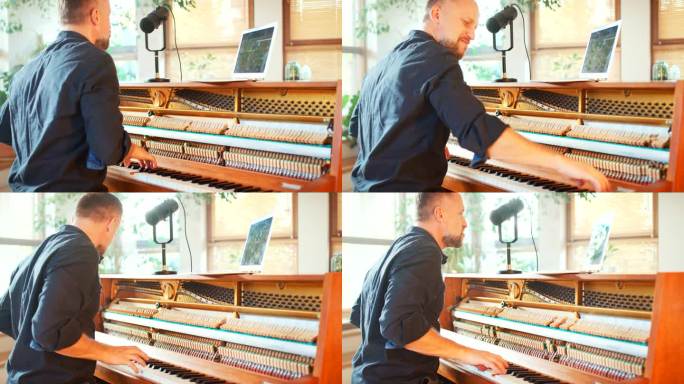 男钢琴家在一架旧钢琴上弹奏古典音乐，并对着麦克风唱歌。平板电脑上的钢琴表