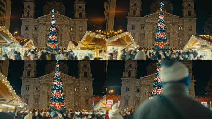 匈牙利布达佩斯，夜晚，市场上的人们与圣斯蒂芬大教堂外被照亮的圣诞树的跟踪拍摄