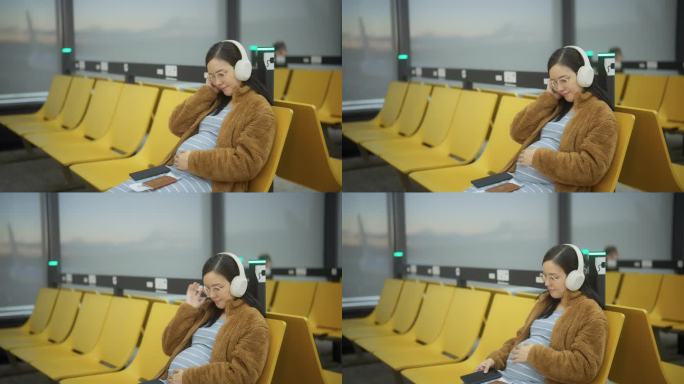 孕妇在登机口边听音乐边玩智能手机